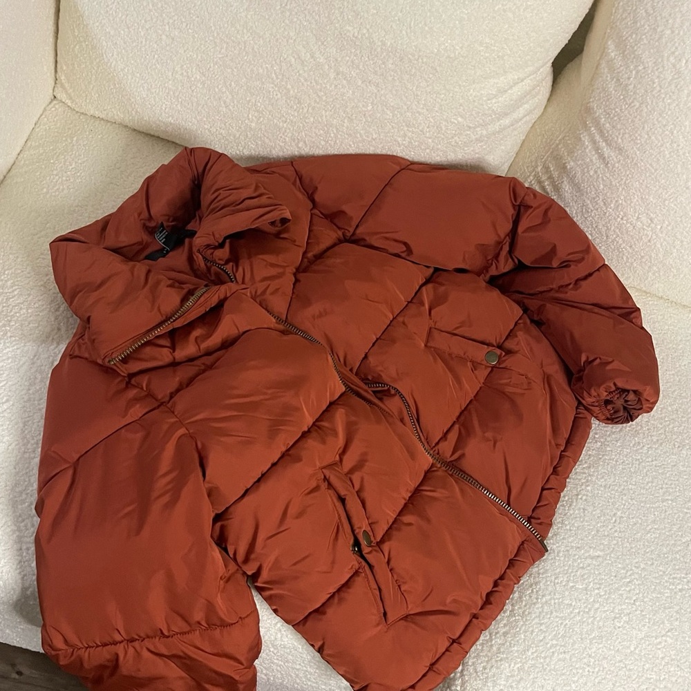 Rust orange puffer jacket